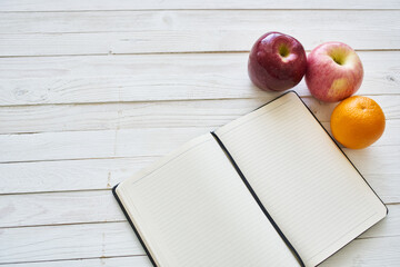 diet notebook fruit healthy food breakfast light background