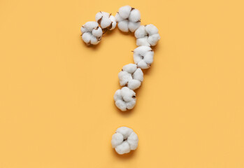 Question mark made of cotton flowers on color background