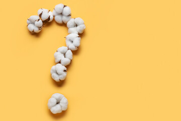 Question mark made of cotton flowers on color background