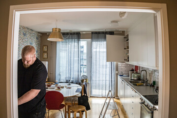 Stockholm, Sweden An electrician working with wiring in a home