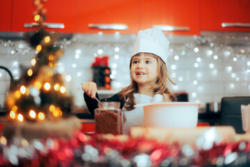 Cheerful Girl with a Jar of Sugar Baking Christmas Cookies