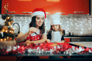 Happy Mother and Daughter Making Gingerbread Together for Christmas