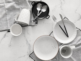 Set of stylish dinnerware on light background