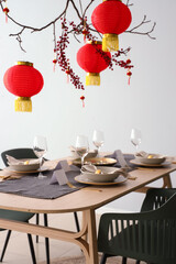 Beautiful table setting for Chinese New Year celebration in room