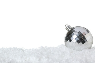 Beautiful Christmas ball on snow against white background