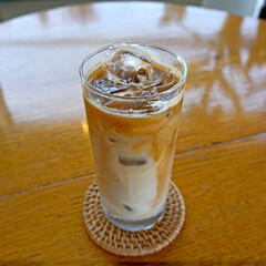 glass of cafe latte with ice