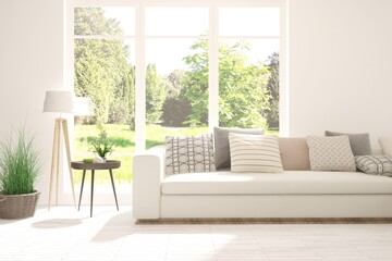 White living room with sofa and summer landscape in window. Scandinavian interior design. 3D illustration