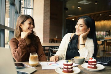 two women sitting in cafe