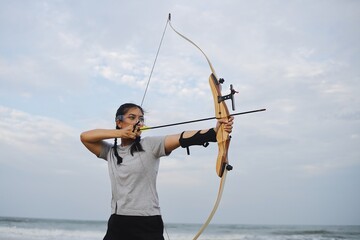 person with bow and arrow