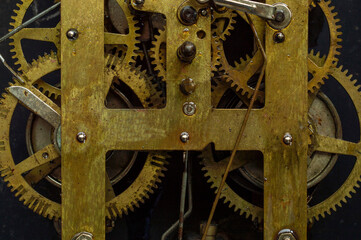 Obraz premium Machine is an apparatus using mechanic power and having several parts, each with a definite function and together performing a particular task. Here is the image of a machine with some parts in focus.