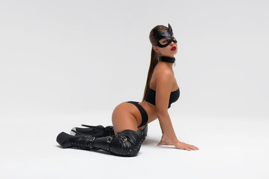 Sensual woman in black mask and underwear