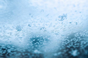 Obraz premium Frosting macro. Cold snow winter background. Blue crystal frozen abstract pattern. White frost ice texture.