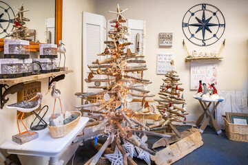 Wooden Christmas tree made from branches and shells found on the ocean shore. Marine souvenir corner. Decorations for Christmas and New Year in a seaside style