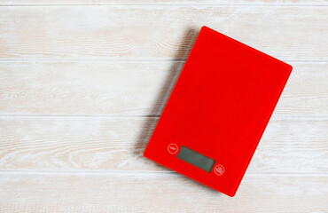 mini kitchen scales for weighing products are insulated on a neutral background