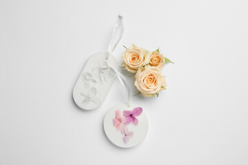 Composition with scented sachets on white background, top view