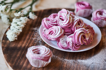 confectioner sprinkles icing sugar with dessert. Powder sugar falls on fresh perfect cupcakes or meringues