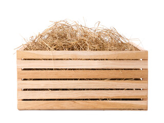 Dried hay in wooden crate on white background © New Africa