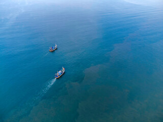 Aerial view of fishing boats off Betalbatim beach at South Goa, located on the West Coast of Maharashtra India.