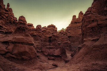 Fototapeta premium Lots of funny and whimsical figures of reddish-brown sandstone. Hoodoo - high thin geological formations. The Goblin Valley is a picturesque place in the famous Goblin Valley State Park. 