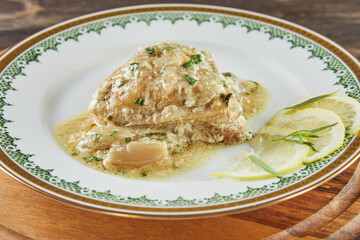 Chicken in tarragon with mustard and pearl onions. French gourmet cuisine