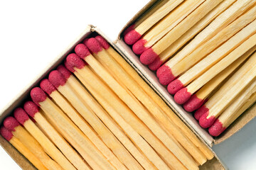 Open boxes of matches close-up on a white background.