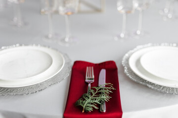 Metal cutlery. Knife and fork on a napkin close-up.