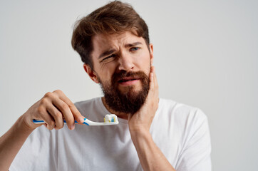 bearded man hygiene toothpaste morning isolated background