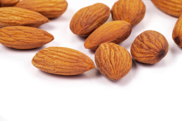 Close up organic almonds on white background. Health food concept.