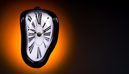 Melting clock on orange background