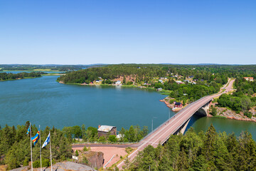 Scenic view of sea and lush shoreline from above in Åland Islands, Finland, on a sunny day in the summer.