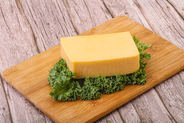 Tasty yelloow Tilsiter cheese brick