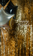 Defocused glowing background in trendy golden color with balloons. Inscription Happy Birthday in focus. Blurred festive texture. 