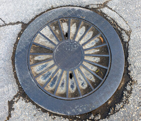 Top view of an old gutter cover with ornament