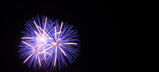 Fototapeta premium Fireworks on dark black background. celebration festival in light. abstract colorful effect bright fireworks for backdrop event party merry christmas and holidays happy new year 2022 concept.