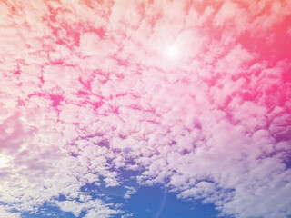 The pinkish-purple sky and bright beams of sunlight
