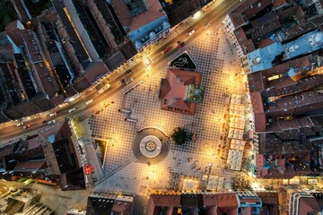 Top down view of Brasov's Council Square at night time, lit up by the street lights. Transylvania, Romania. 