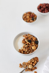 Homemade breakfast granola with nuts and raisins. Healthy food.
Copy space. 