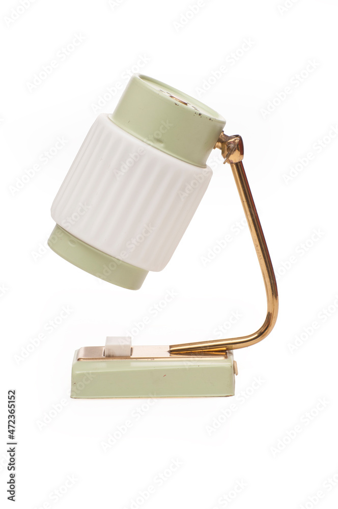 Wall mural Old decorative mini desk lamp on white background