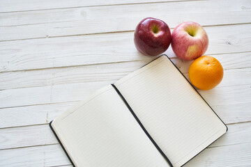 diet notebook fruit healthy food breakfast light background