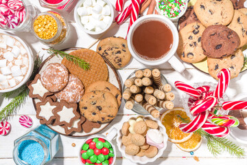 Christmas hot chocolate party bar, winter cocoa buffet with a lot of hot chocolate mugs, various topping, sprinkles, sweet appetizers