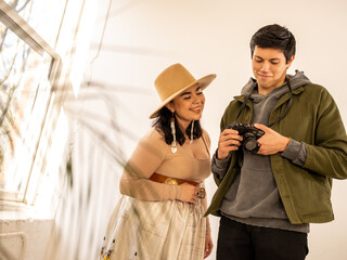 Young Indigenous model and photographer doing a photo session indoors