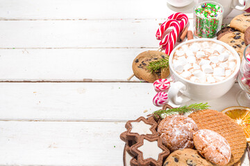 Christmas hot chocolate party bar, winter cocoa buffet with a lot of hot chocolate mugs, various topping, sprinkles, sweet appetizers