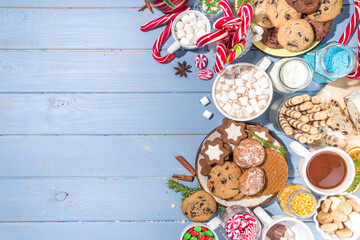 Christmas hot chocolate party bar, winter cocoa buffet with a lot of hot chocolate mugs, various...
