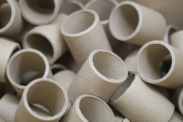 Empty cardboard spools in bulk in a box. Reels with a diameter of 40 mm for winding paper....