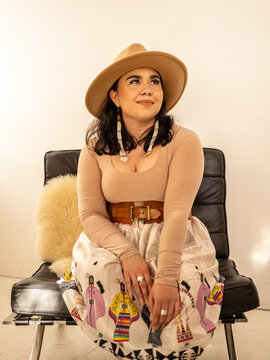 Young Indigenous female model indoors