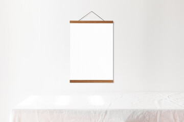 Poster hanger mockup on white wall 