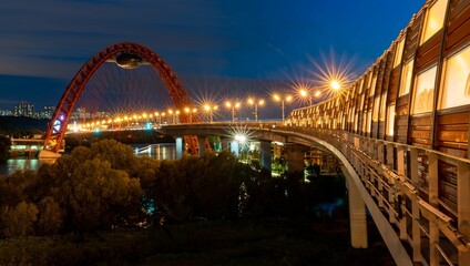 Obraz premium Beautiful bridge over the river in summer evening