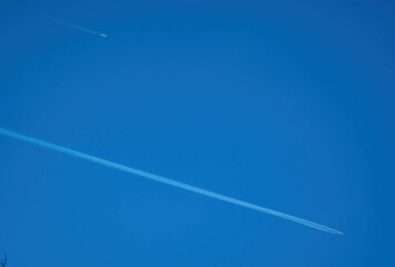 Airplane trail on blue sky