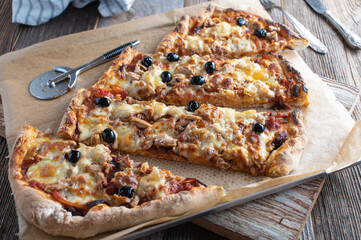 Sliced Pizza on wooden table