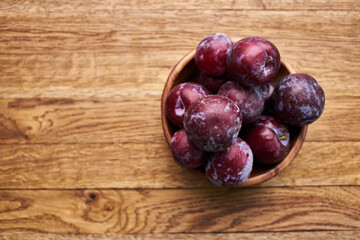 plums fruits natural products on a wooden table top view